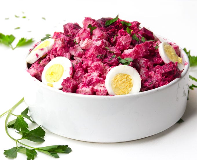 Potato, beetroot and egg salad in a salad bowl.