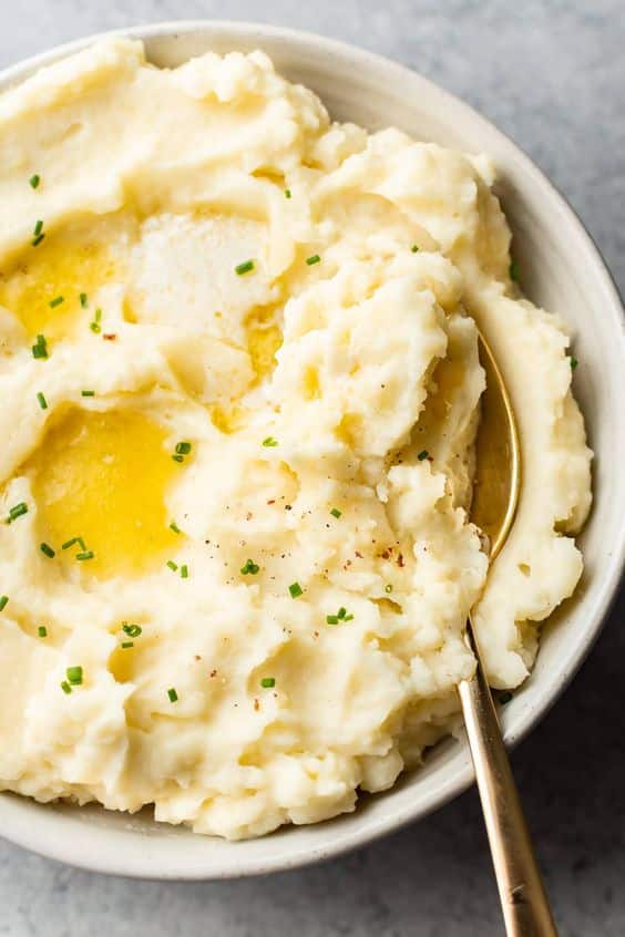 Mashed garlic potatoes with chives and butter.