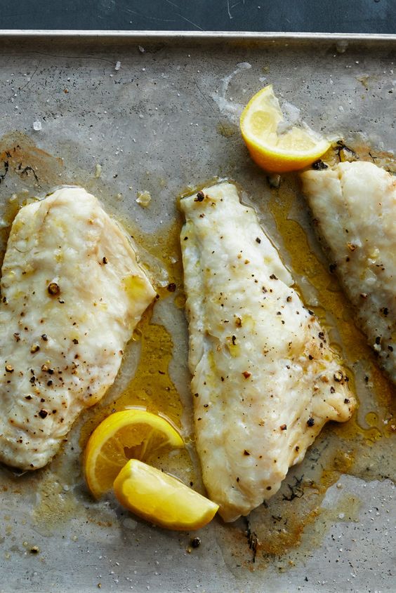 Cod fillets baked with butter and lemon juice.