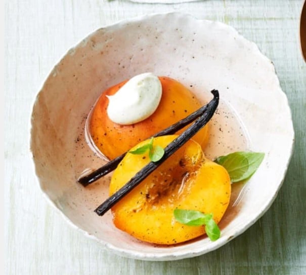 Poached peaches on sparkling wine with basil and vanilla.