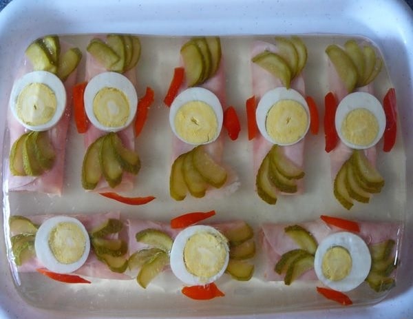New Year's delicacies in the form of ham rolls in aspic