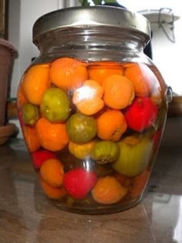Canned hot peppers in a jar.