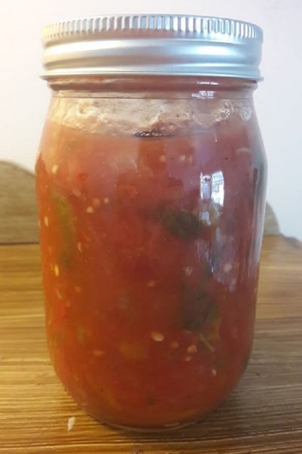 Pickled lecho in a mason jar.