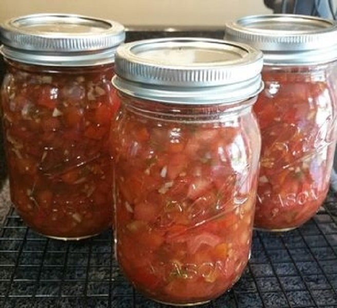 Pickled lecho in canning jars.