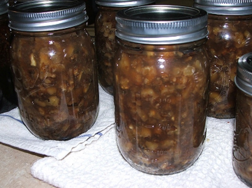 Several mason jars with walnuts.
