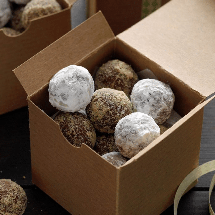 A box of honey balls with rum.