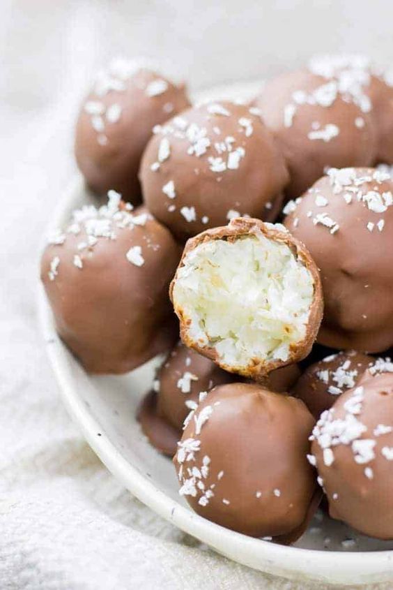 Recipe for unbaked coconut balls in chocolate.