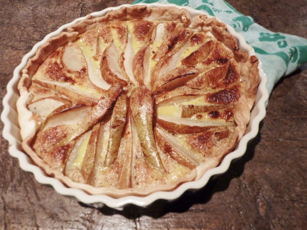 baked pie covered with pears