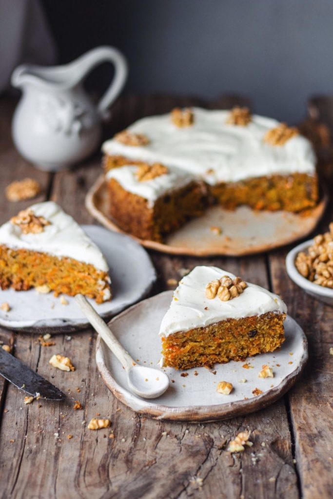 carrot cake with cream frosting and nuts