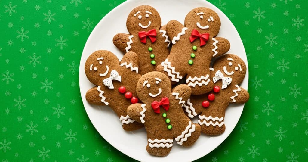 Ready decorated gingerbread cookies with snow topping.