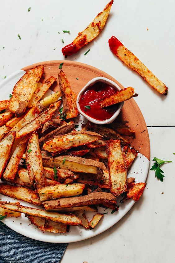 Seasoned fries served with ketchup