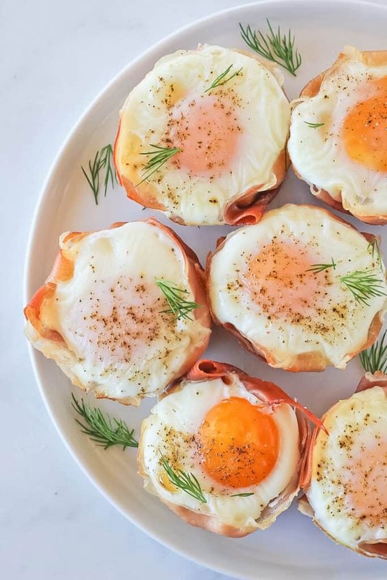 Baked buns with egg in molds