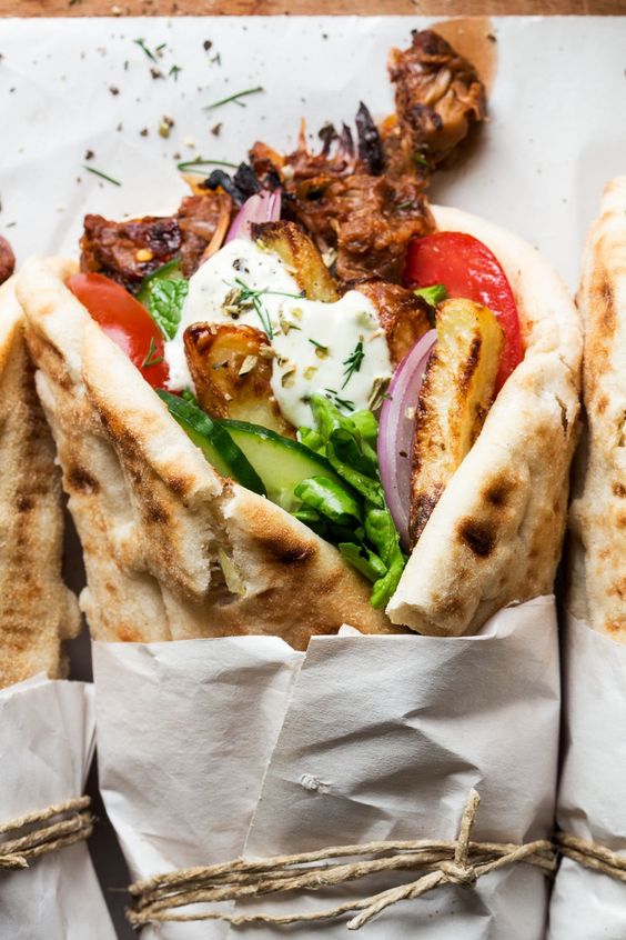Pita bread filled with meat mixture with vegetables