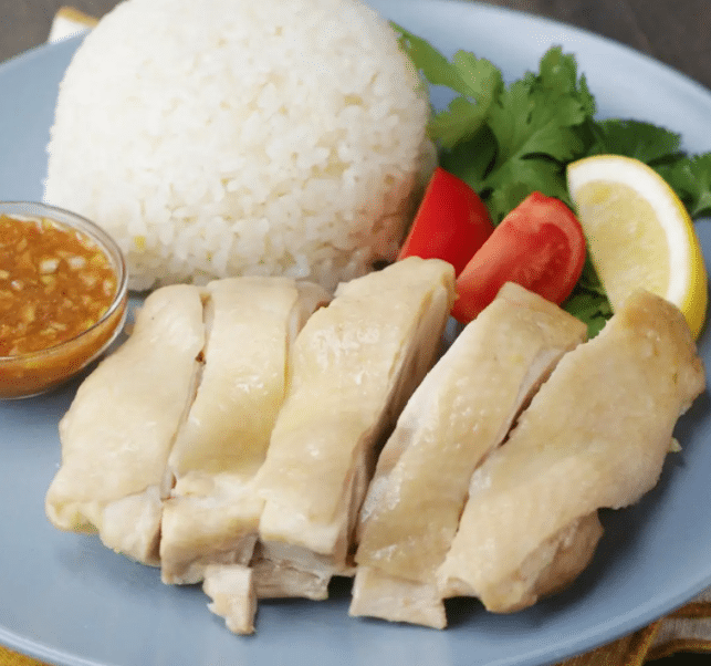 chicken pieces with rice and sauce

