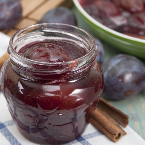 Baked plums with spices in a jar