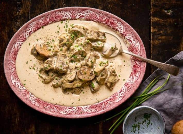 Stewed pieces of beef with mushrooms in a cream sauce