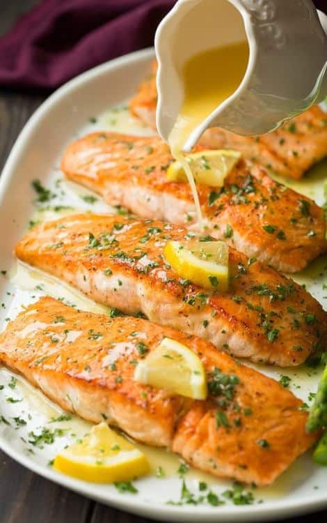 Salmon fillets served with garlic butter