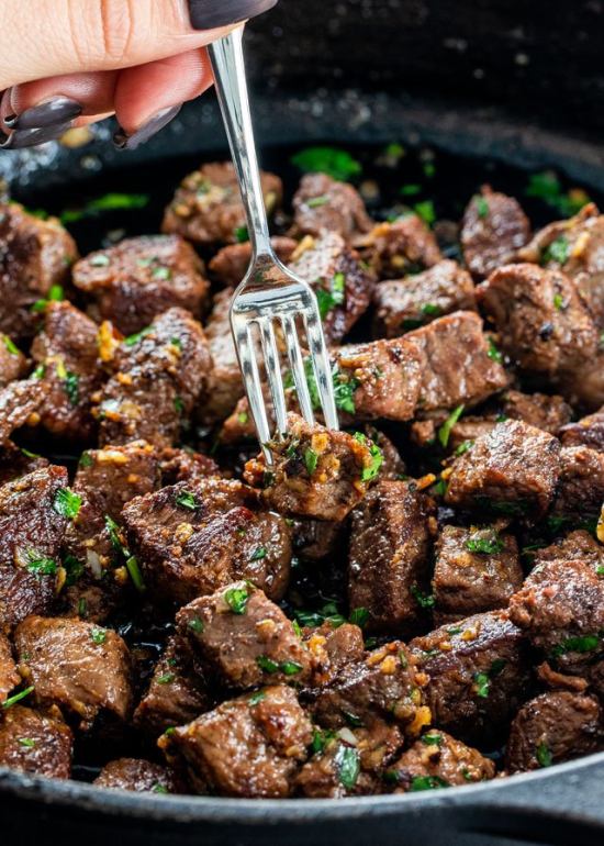 Golden fried beef cubes with garlic and fresh parsley