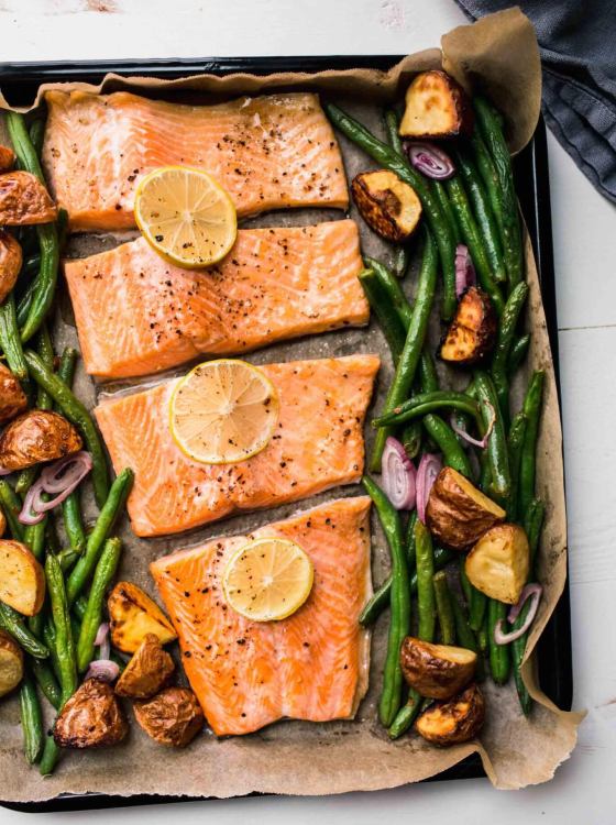 Salmon fillets with vegetables baked in the oven