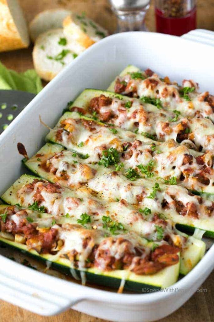 Baked zucchini stuffed with minced meat and vegetables