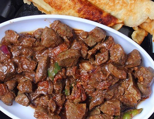 Liver stew with vegetables, served with white flour pancakes.