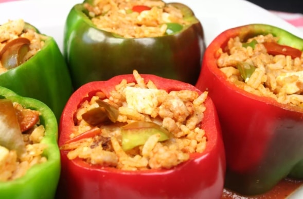 Green and red stuffed Hungarian peppers with vegetables, meat and rice.