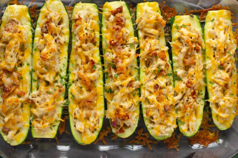 Zucchini boats baked with cheese, chicken and bacon