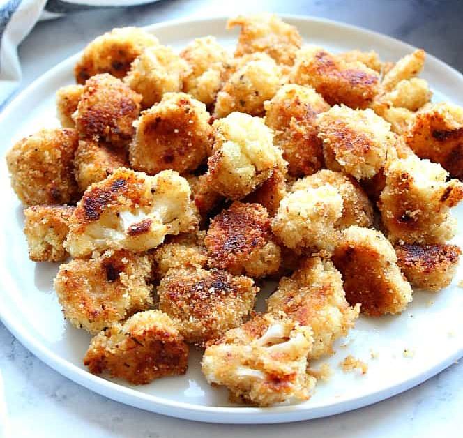 Pieces of cauliflower coated in a mixture of breadcrumbs and parmesan cheese