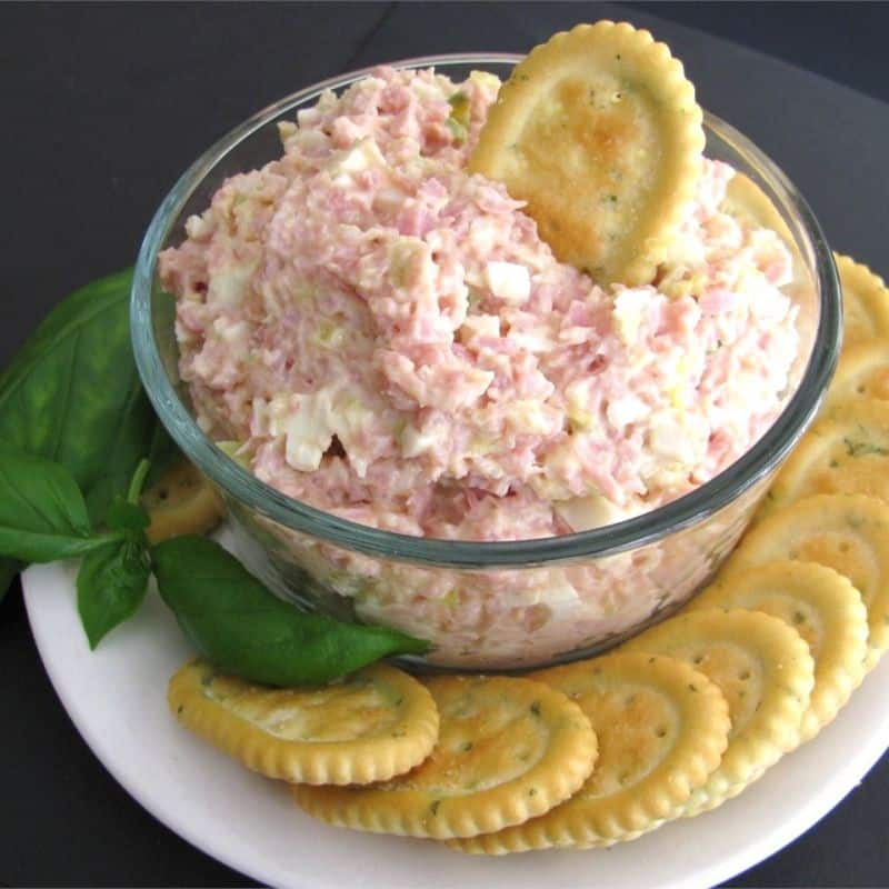 Egg and ham spread dish served with saltine crackers