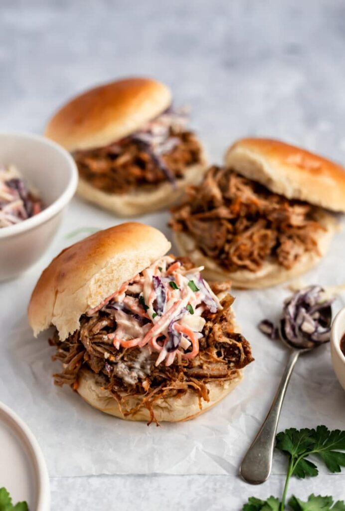 Burgers with pulled pork and coleslaw.