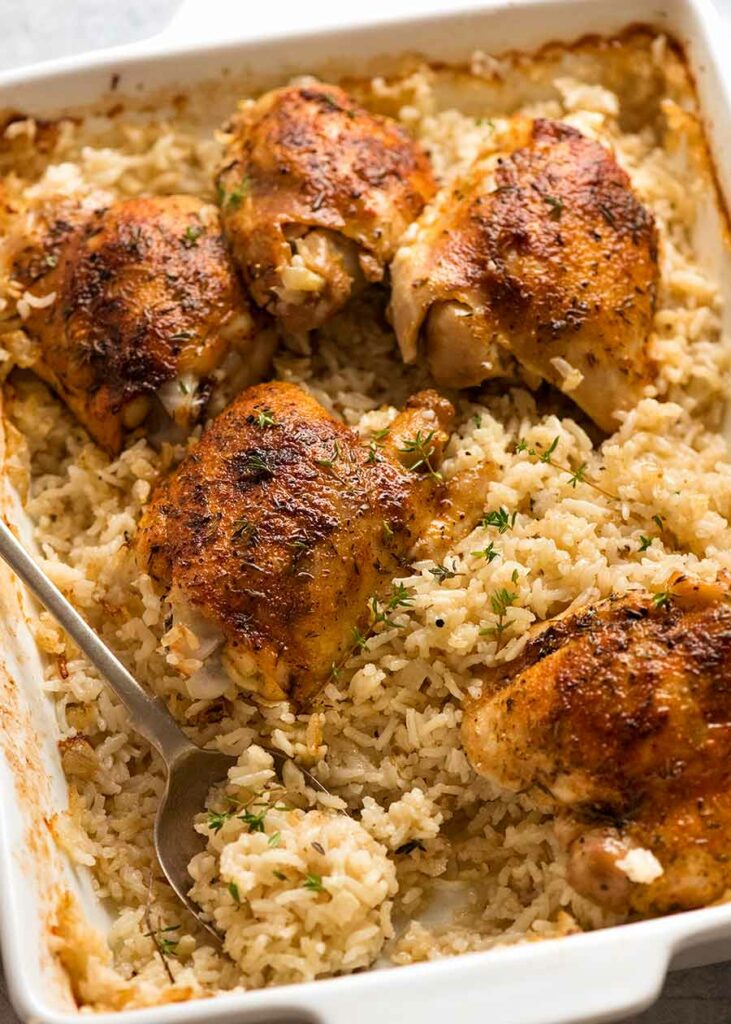 Chicken pieces with rice and thyme from one baking dish.