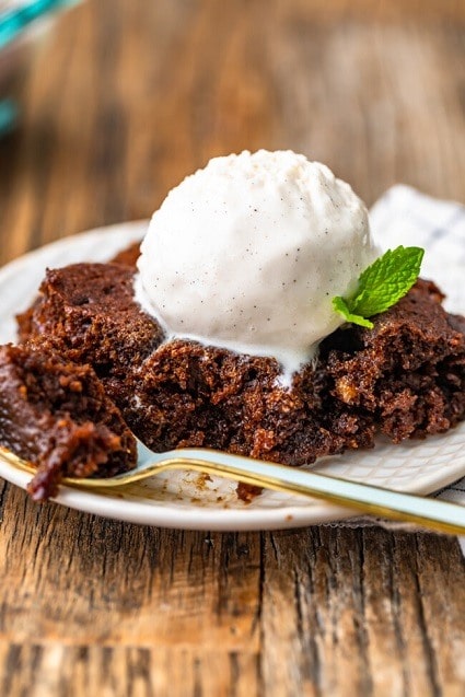 Moist gingerbread dessert served with ice cream and fresh mint.