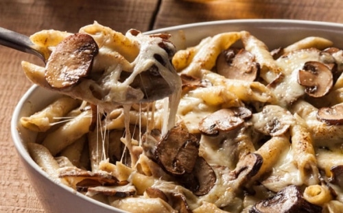 Baked pasta with mushrooms and cheese.