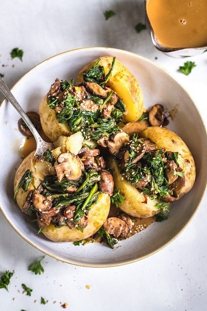 Baked potatoes with mushrooms and spinach.