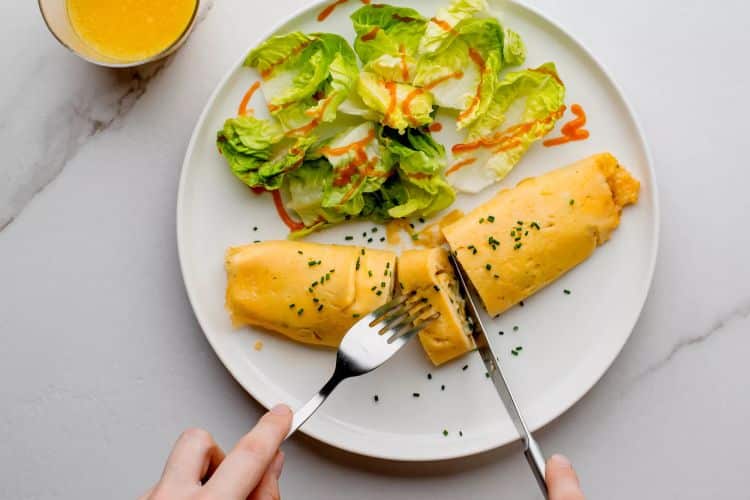 A French version of an omelet served with a salad
