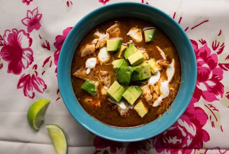 Soup with cheese, avocado and sour cream.