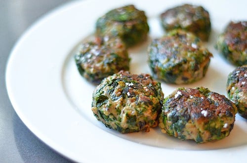 Mushroom balls with spinach and meat on a plate.