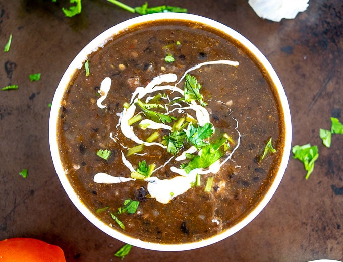 Bean soup with coriander and sour cream.