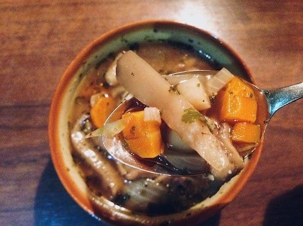 Vegetable soup with mushrooms and herbs.