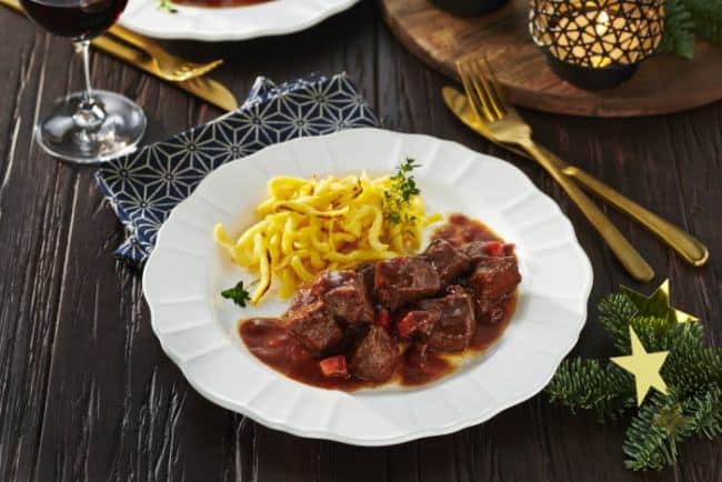 Goulash prepared from boar meat served with pasta