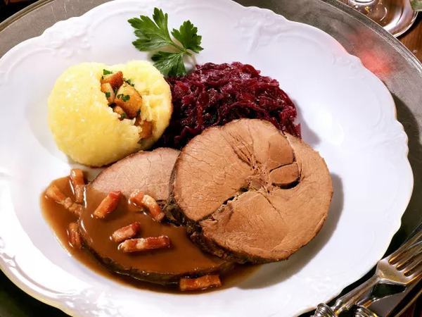 Slices of boar meat with red cabbage and potato dumpling