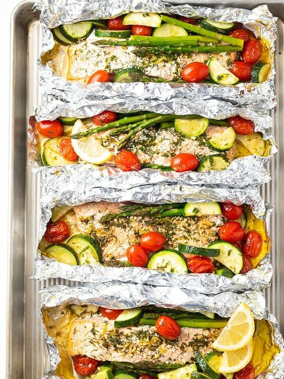 Salmon with vegetables baked in foil.