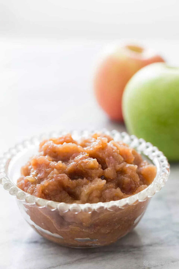 Apple sauce with garlic and spices in a bowl.