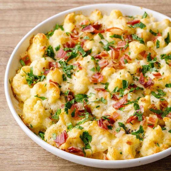 Cauliflower with eggs, bacon and fresh parsley.