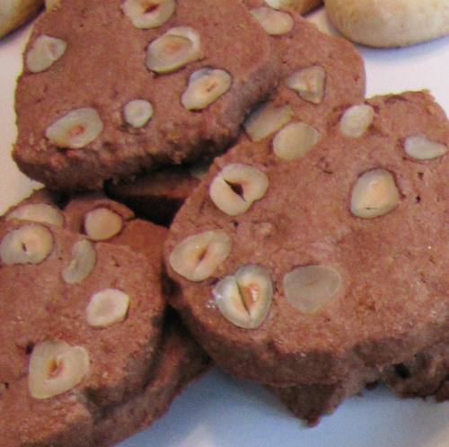 Pieces of Christmas cookies with hazelnuts.