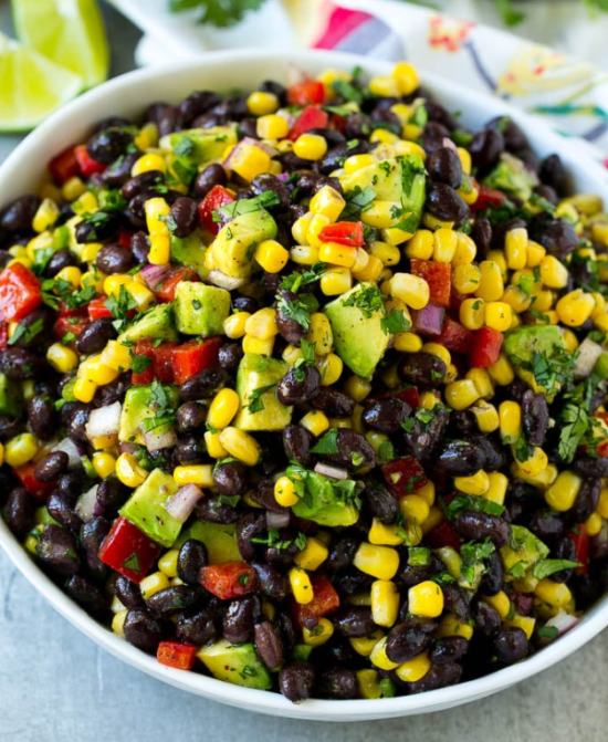A mixture of black beans, corn, peppers and avocado and a spicy dressing