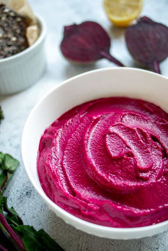 Beetroot dip with cheese served in a bowl.