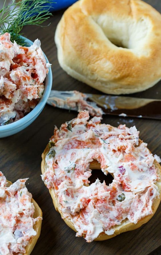 Bagel with smoked salmon spread and chopped dill.