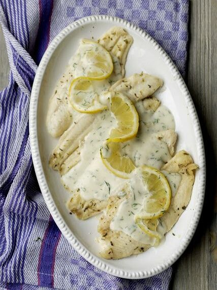 Fish baked in a cream sauce with lemon and herbs.