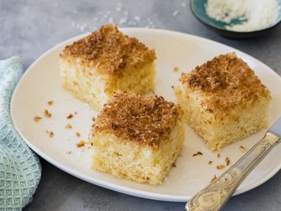 Coconut pudding baked on a baking sheet.